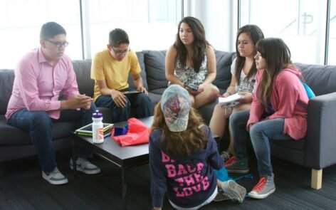 Teens participate in discussions, hands-on activities, and interactive presentations.