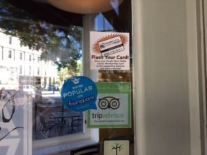 Look for the Flash Your Card decal in business windows like this one at La Luz in Old Town.