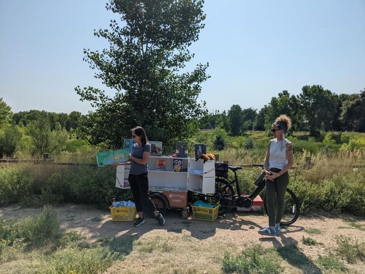 Library staff outside with the book bike