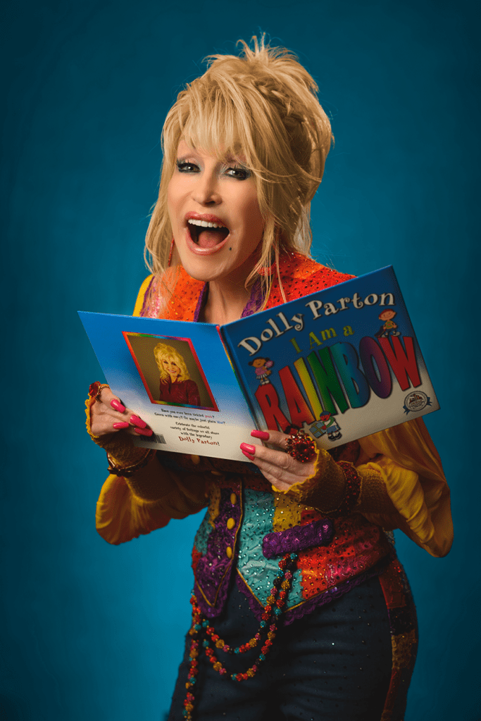 image of dolly parton holding a picture book