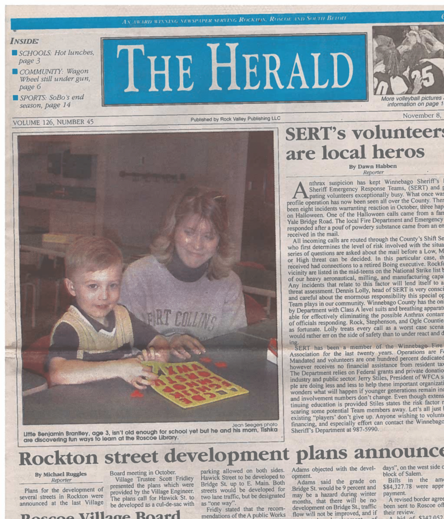 newspaper article of mother and son at a library